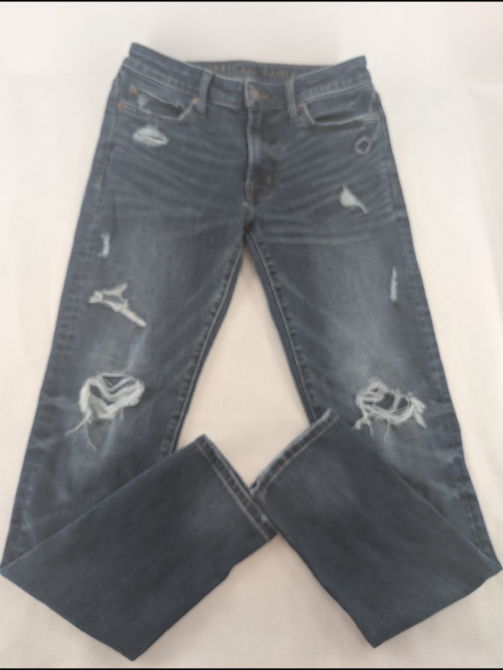 American Eagle distressed slim-fit jeans featuring "Next Level" AirFlex